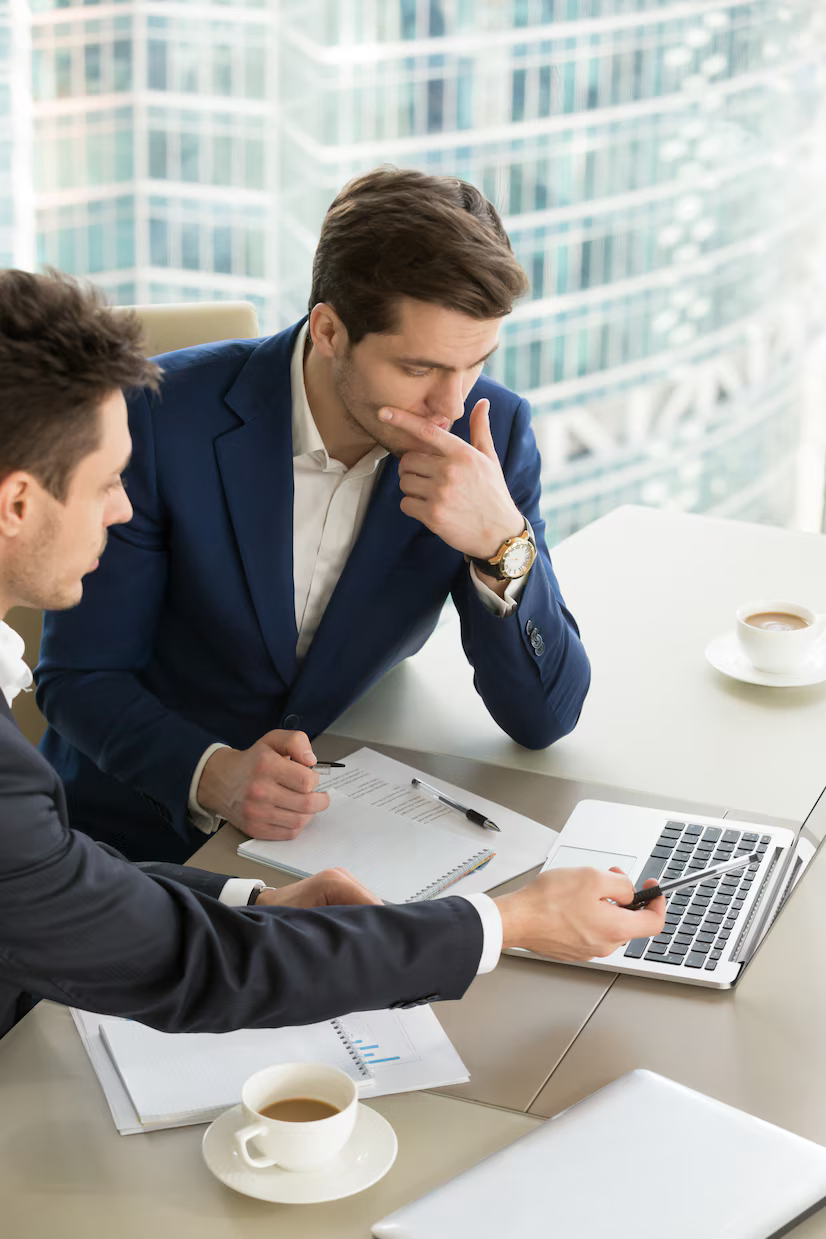 Real estate professionals reviewing property details